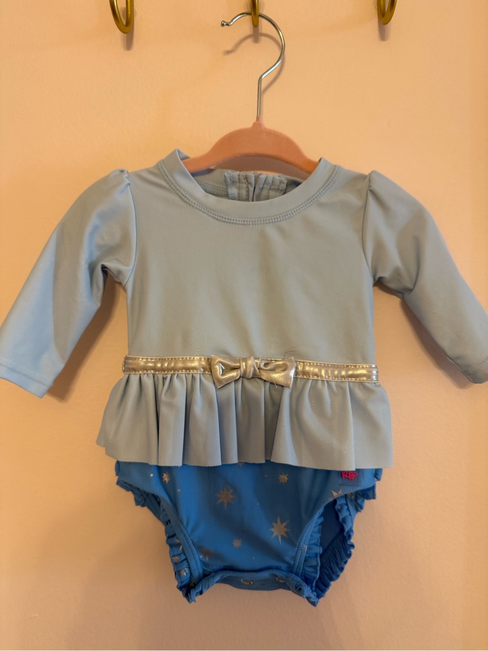 Girls Light Blue Long-Sleeve Peplum Rashguard Swimsuit with Gold Bow Detail